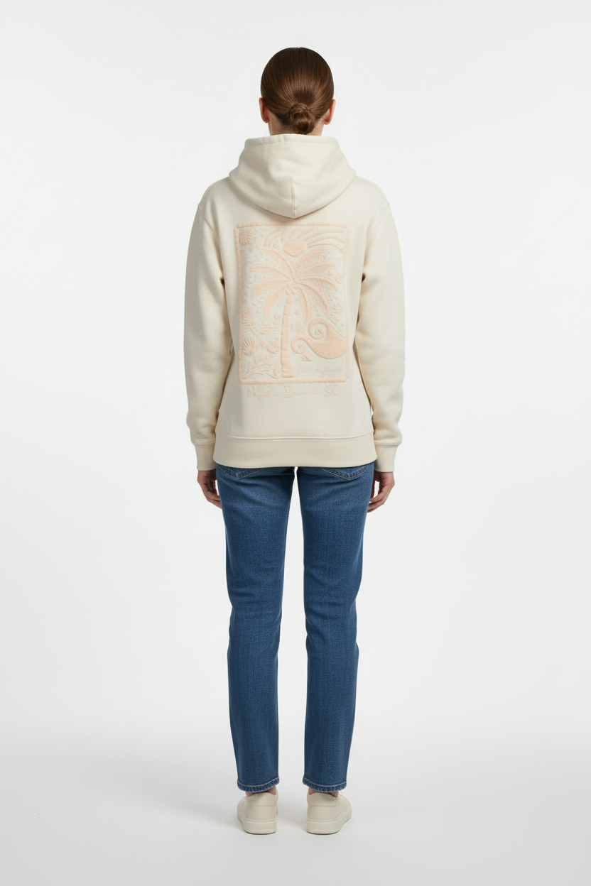 Female model back view wearing embroidered hoodie with denim jeans
